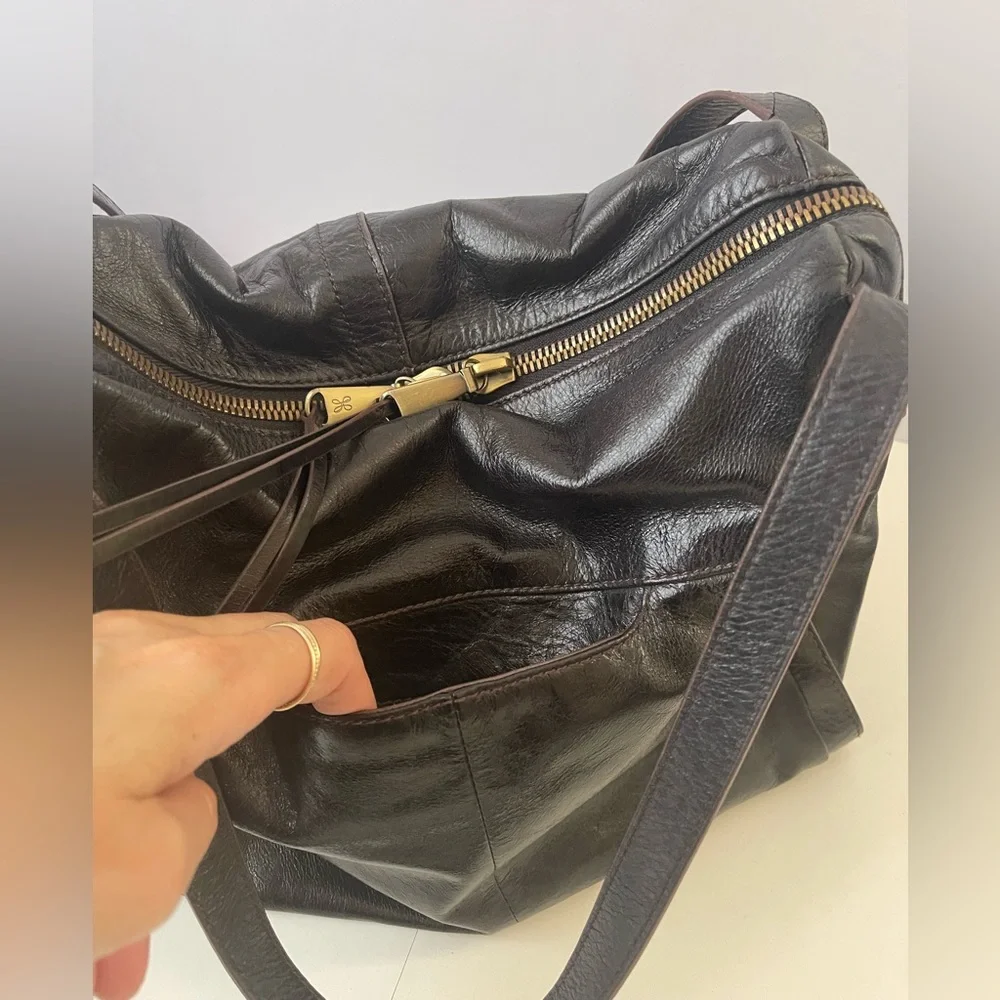 HOBO Slouchy Leather Bag With Tassels and Brass Hardware